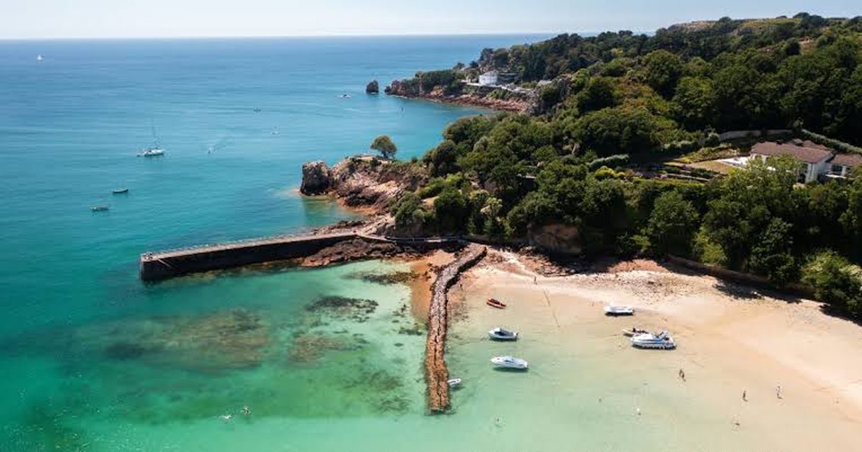Aerial view of St Brelade's Bay, Jersey, with its stone pier