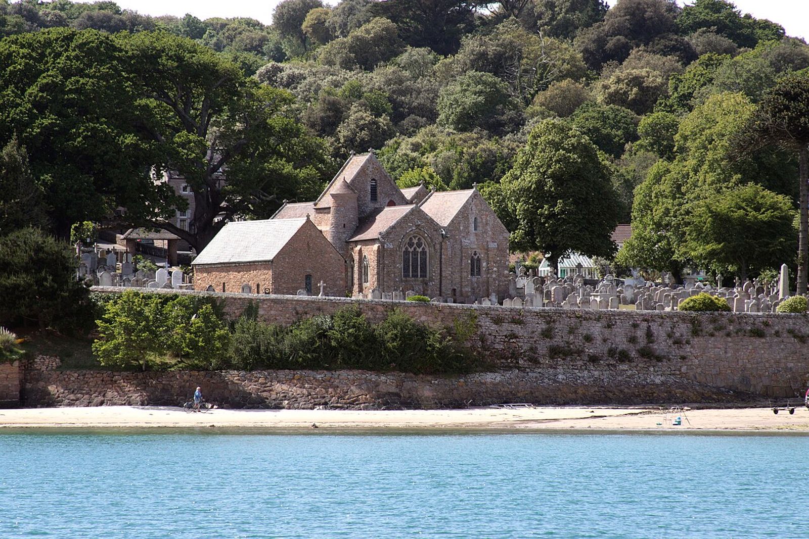 St Brelade's Parish Church and the Fisherman's Chapel on the shore of St Brelade's Bay, Jersey